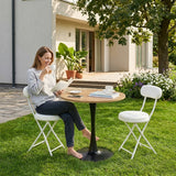 Ensemble de salle à manger de style scandinave comprenant une table ronde en chêne et quatre chaises pliantes blanches