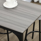 Ensemble de table haute avec quatre tabourets au design industriel gris en métal