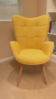 Scandinavian armchair with armrests in yellow fabric with stitching - bogdan